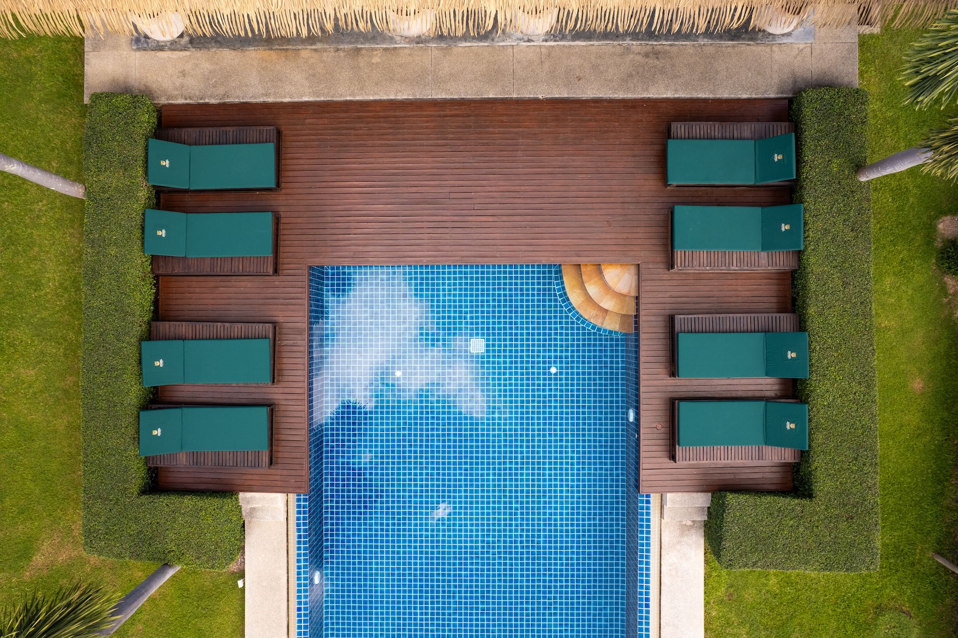 Green Garden Villas pool pavilion surrounded by palms